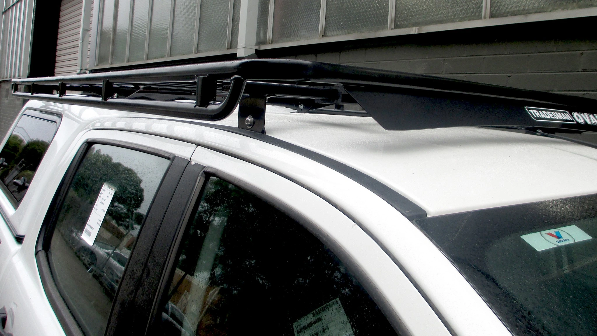 Flat-deck-full-length-Oval-Steel-roof-rack-with-up-side-down-rails-on-a-Ford-Ranger-and-ARB-canopy