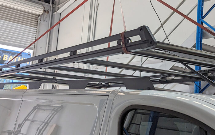 Roof racks being fitted to a van